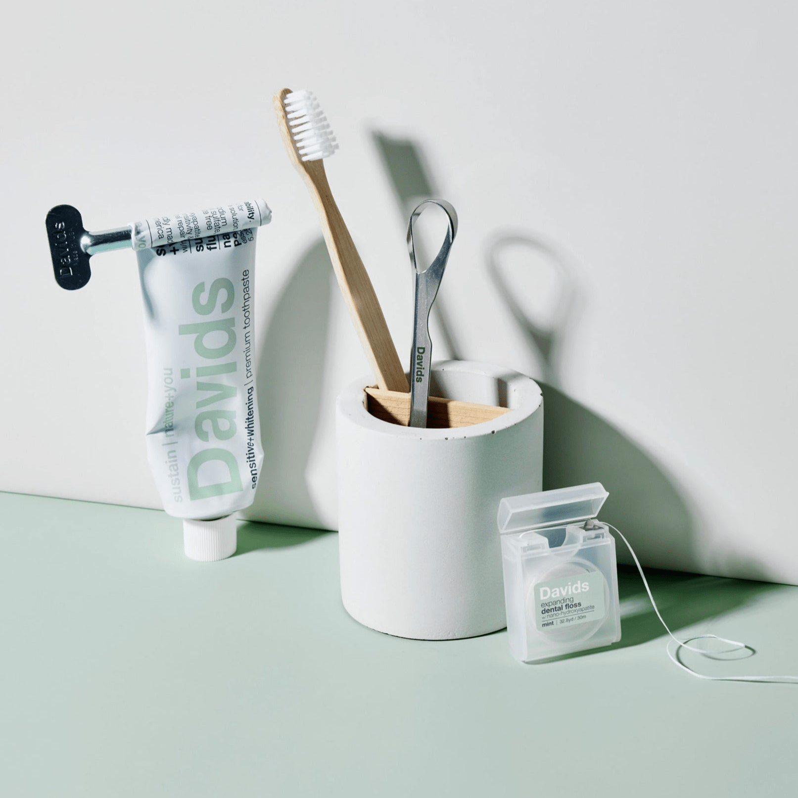 Davids essential sensitive teeth bundle / nano hydroxyapatite toothpaste + tongue scraper + toothbrush + floss